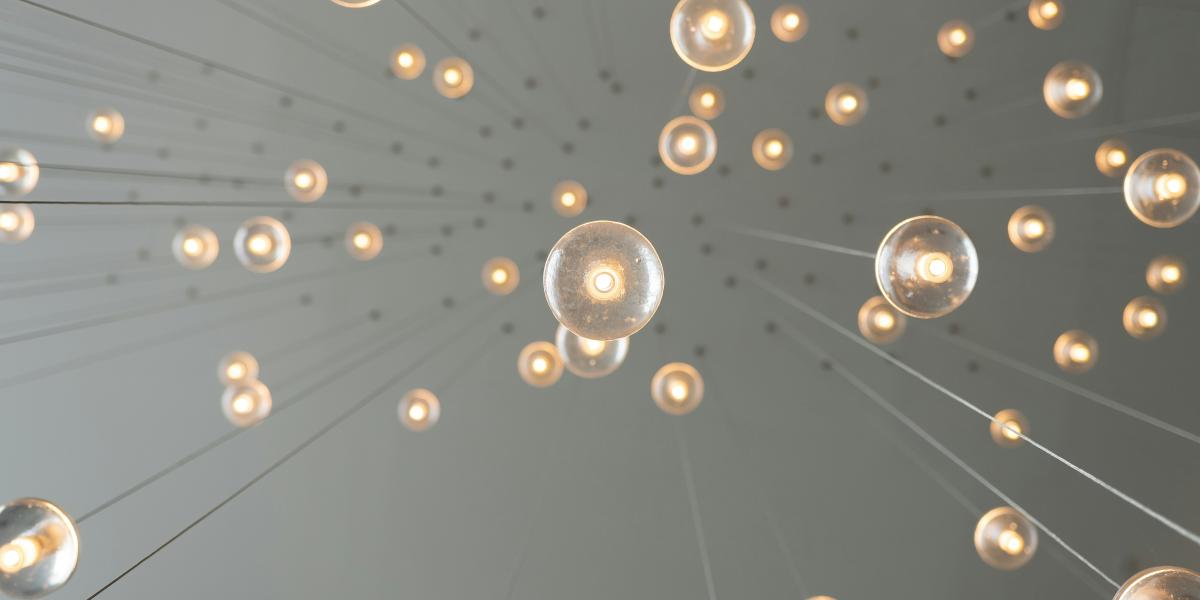 Image of lightbulbs connected, photo by Skye Studios on Unsplash  